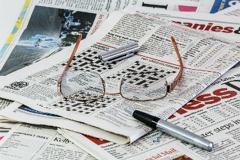 Glasses on newspapers